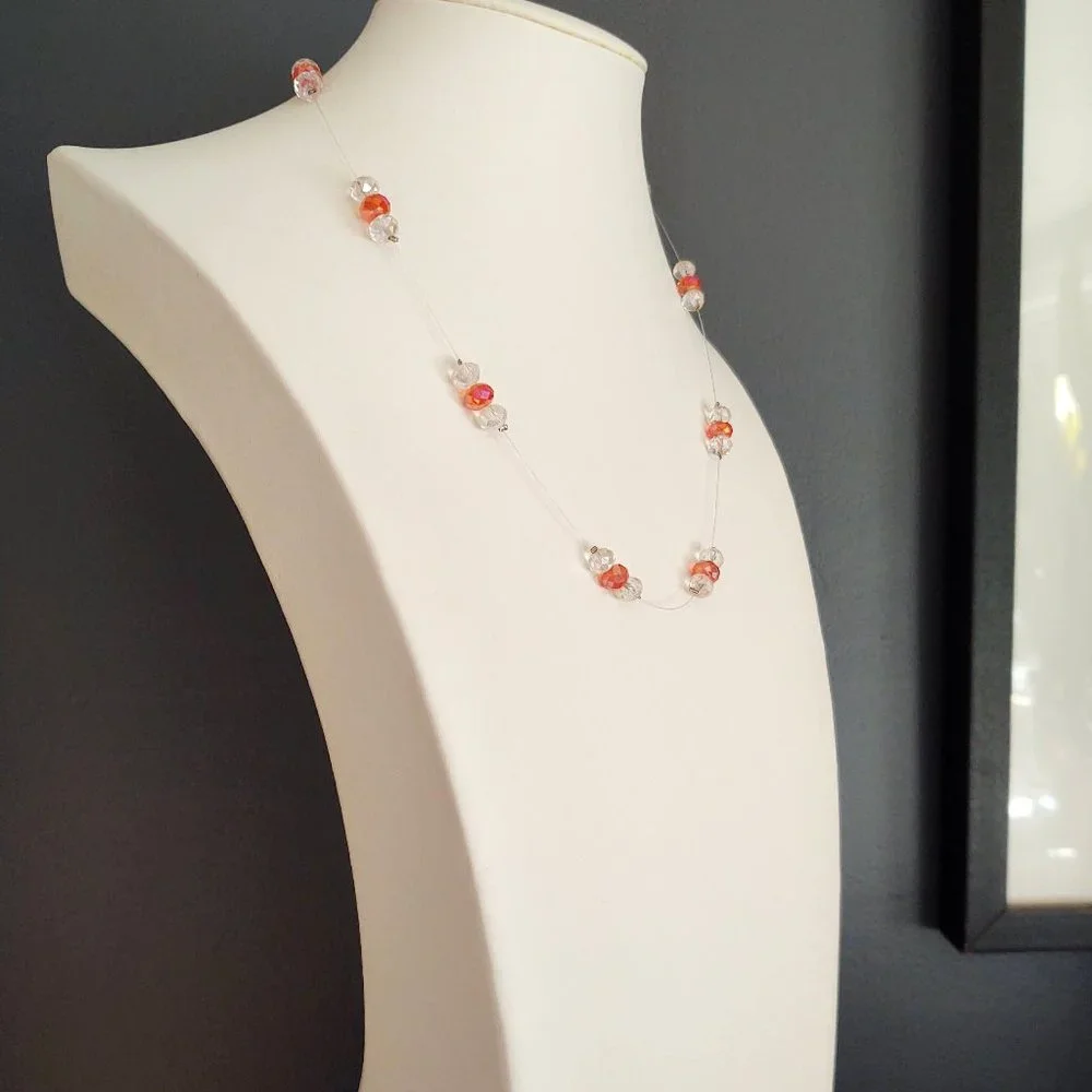 Floating clear and orange crystal necklace